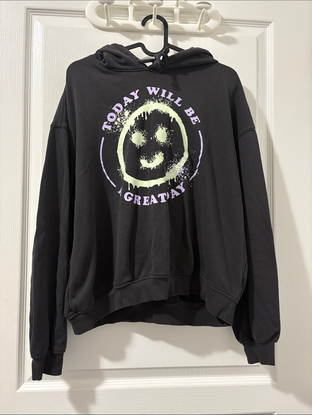 Divided Black Hoodie with Pastel Green Smiley and Lavender Text
